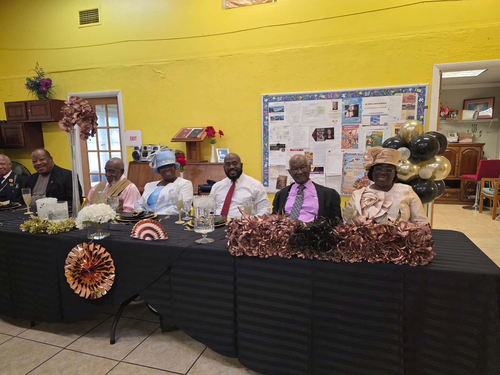 A group seated at a decorated table