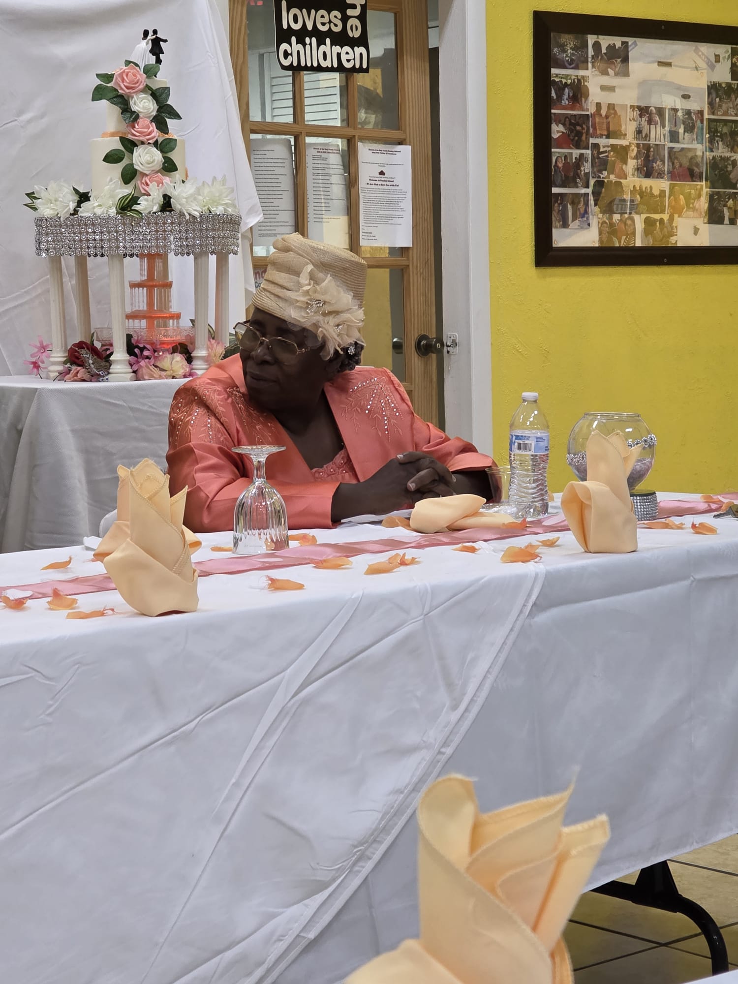 A woman seated at a decorated event table